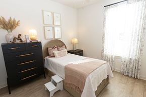 Villa Rica apartment for rent - A bedroom with a bed, nightstand, and a dresser with a vase on top.