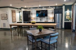 Villa Rica apartment for rent - A modern dining room with a wooden table and chairs.