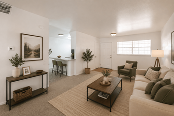 Odessa apartment for rent - A living room with a white couch, a coffee table, and a painting on the wall.
