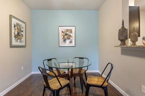 Midland apartment for rent - A dining room with a glass table and chairs.