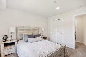 Ridge apartment for rent - a spacious bedroom with a bed and a closet at Brookwood at Ridge, New York, 11961
