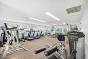 Ridge apartment for rent - a view of our gym with various machines and weights at Brookwood at Ridge, New York, 11961