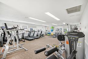Ridge apartment for rent - a view of our gym with various machines and weights at Brookwood at Ridge, New York, 11961