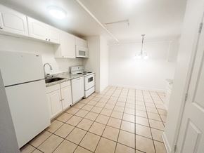 Nashville apartment for rent - A kitchen with white appliances and cabinets.