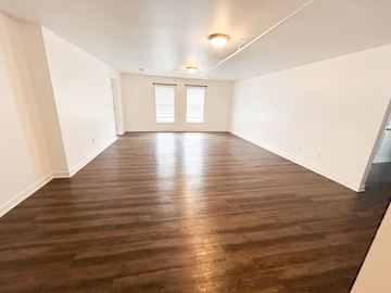 Nashville apartment for rent - A room with wooden flooring and a window.