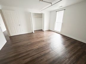 Nashville apartment for rent - A room with wooden flooring and white walls.