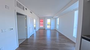 Northridge apartment for rent - A long hallway with a red sign that says "NO PARKING" on the wall.