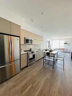 Los Angeles apartment for rent - a kitchen with stainless steel appliances and a table and chairs