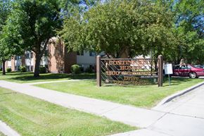 Grand Forks apartment for rent - A sign for a gontin home for the aged is in front of a building.