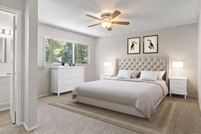 Los Angeles apartment for rent - A bedroom with a large bed, a dresser, and a ceiling fan.