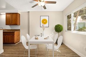 Encino apartment for rent - a dining room with a white table and chairs and a ceiling fan at White Oak Terrace Apartments, Encino, 91316