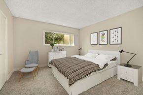Encino apartment for rent - a bedroom with a bed and wallpaper on the wall at White Oak Terrace Apartments, Encino