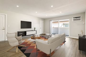 Valley Village apartment for rent - A modern living room with a white sofa and a television.