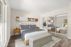 Encino apartment for rent - A bedroom with a large bed and a mirrored closet door.