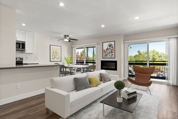 Encino apartment for rent - A modern living room with a white couch and a black coffee table.