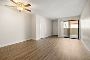 Chatsworth apartment for rent - A room with a ceiling fan and wooden flooring.