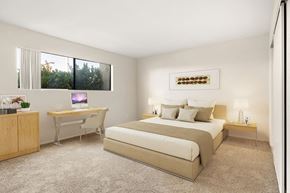 Canoga Park apartment for rent - A bedroom with a bed, desk, and chair.