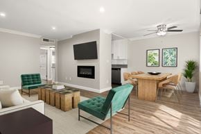 Sherman Oaks apartment for rent - A living room with a fireplace and a television.