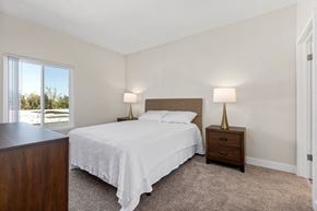 North Hollywood apartment for rent - a bedroom with a bed and a window at Woodland Trio Apartments, California