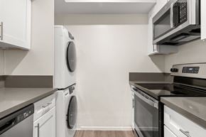 Westlake Village apartment for rent - A modern kitchen with white cabinets and stainless steel appliances.