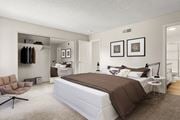 Westlake Village apartment for rent - A bedroom with a large bed and a chair.