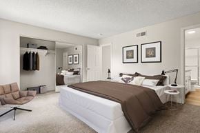 Westlake Village apartment for rent - A bedroom with a large bed and a chair.