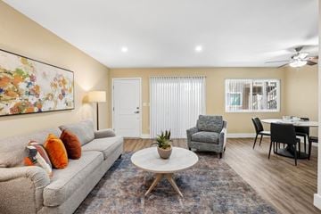 Los Angeles apartment for rent - A living room with a grey couch, a white coffee table, and a painting on the wall.