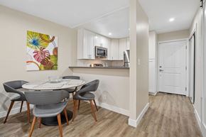 North Hollywood apartment for rent - A kitchen with a dining table and chairs.