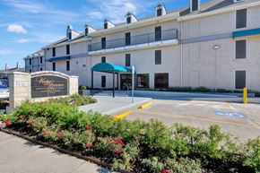 Houston apartment for rent - A large building with a sign that says "Westgate" in front of it.