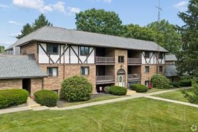Canton apartment for rent - A large house with a balcony and a covered patio.