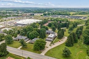 Canton apartment for rent - A bird's eye view of a suburban area with houses and a road.