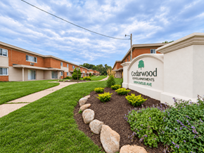 Willoughby apartment for rent - Cedarwood Apartments is a residential complex with a well-maintained garden in front.