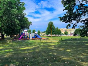 Willoughby apartment for rent - Playground with a slide and a purple slide at Emerald Village Apartments, Willoughby, OH, Ohio, 44094