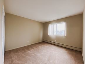 Brookpark apartment for rent - an empty bedroom with a window and carpeting