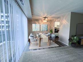 University Heights apartment for rent - a dining room with a table and chairs and a ceiling fan at Huntington Green Apartments, University Heights, 44118