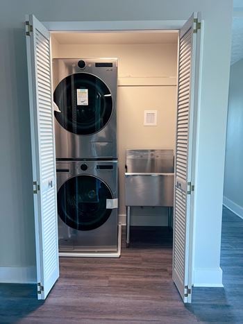 A laundry room with a washer and a dryer