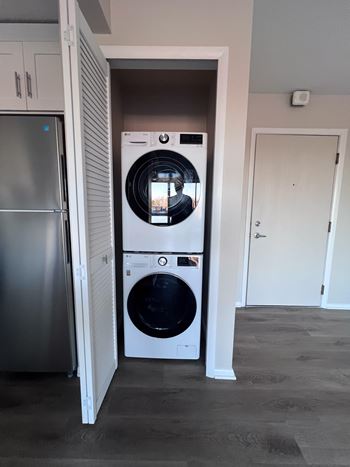 A front loading washer and dryer in a closet