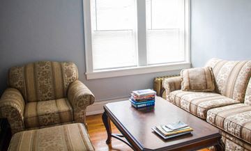 Cleveland Heights apartment for rent - a living room with two couches and a coffee table with books