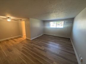 Middleburg Heights apartment for rent - A room with wooden flooring and a window.