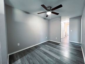 Ashland apartment for rent - a living room with gray walls and a ceiling fan