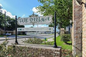Houston apartment for rent - a sign for the lake magic theater on the corner of a street