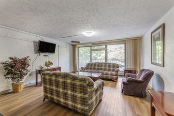 East Cleveland apartment for rent - a living room with couches and chairs and a tv