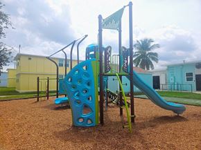 Ft Lauderdale apartment for rent - A playground with a blue slide and a green flag.