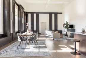 Homestead apartment for rent - A dining room with a table set for two and a bar area.
