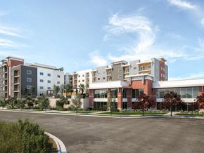 Draper apartment for rent - A modern apartment complex with multiple buildings and a parking lot in front.