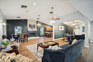 Ocala apartment for rent - A living room with a dark blue couch and a coffee table.