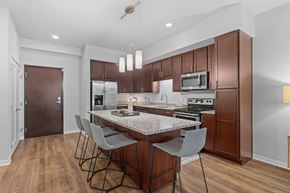Bloomington apartment for rent - A kitchen with a table and chairs in the middle of it.