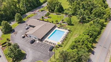 Goodlettsville apartment for rent - A large building with a pool in front of it.
