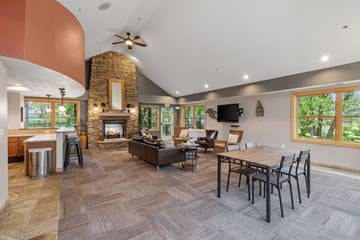 White Bear Lake apartment for rent - a living room with a fireplace and a table with chairs