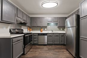 Southaven apartment for rent - A kitchen with a refrigerator on the right.